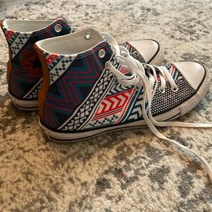 Converse high top with leather detailing. Size 10